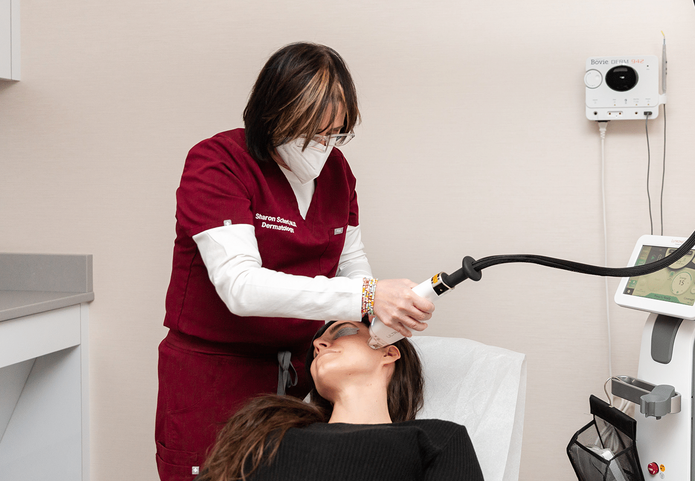 doctor performing acne treatment