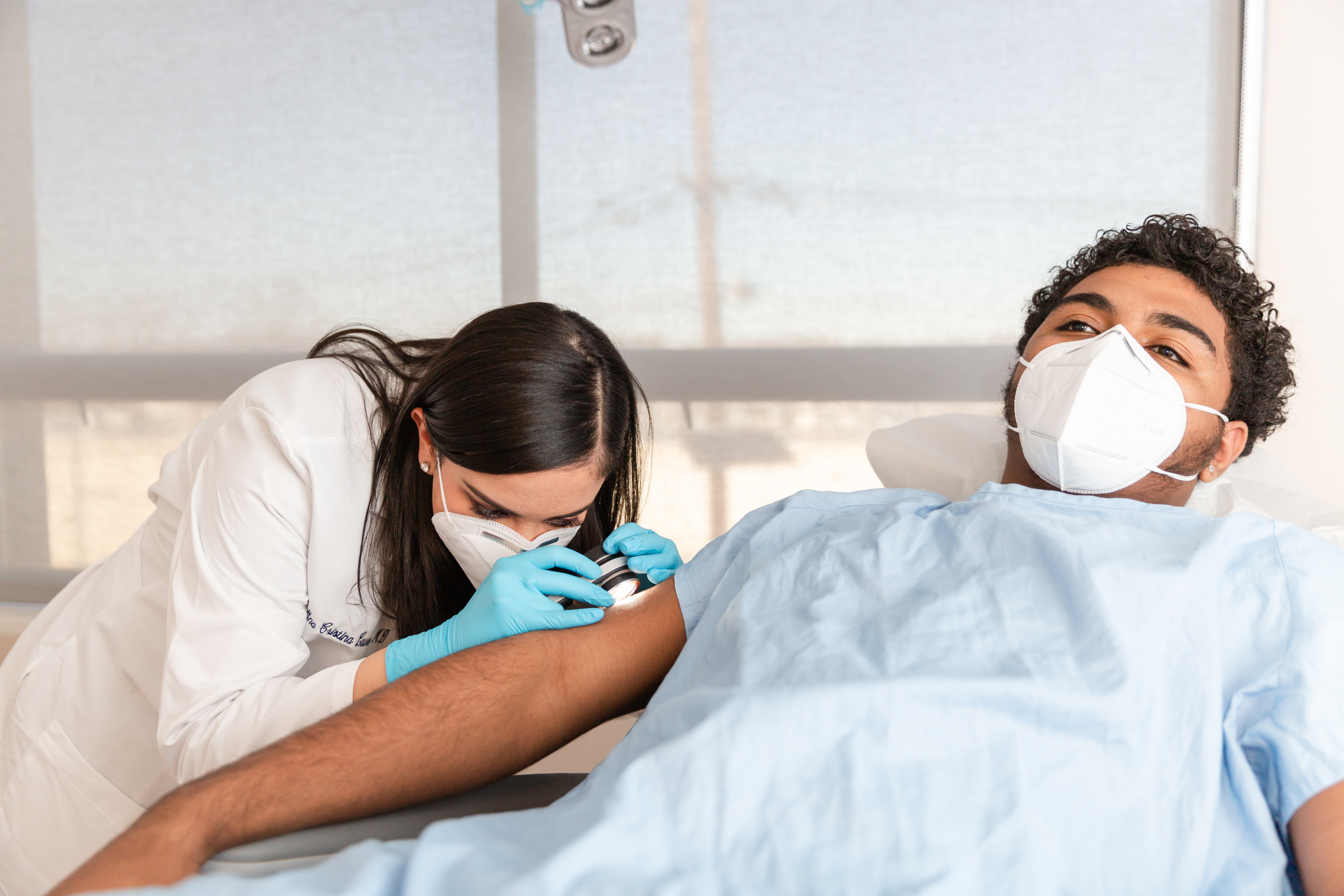 doctor performing a rash treatment on a patient from Englewood Cliffs