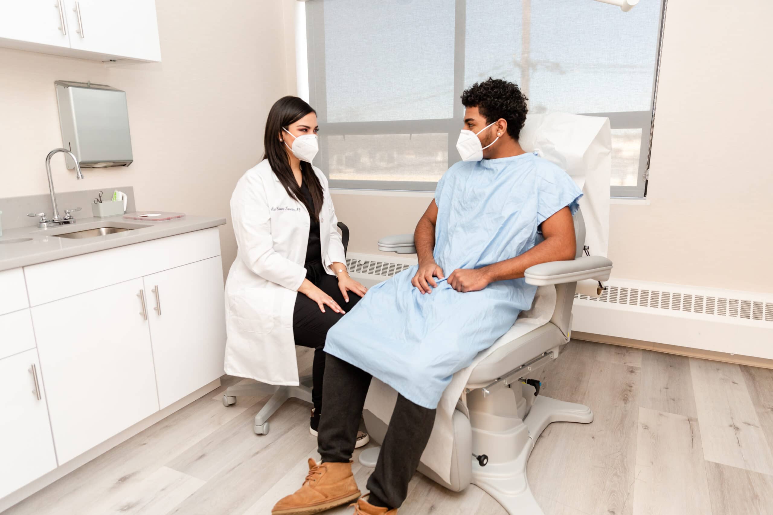 doctor and patient discussing hair loss treatment