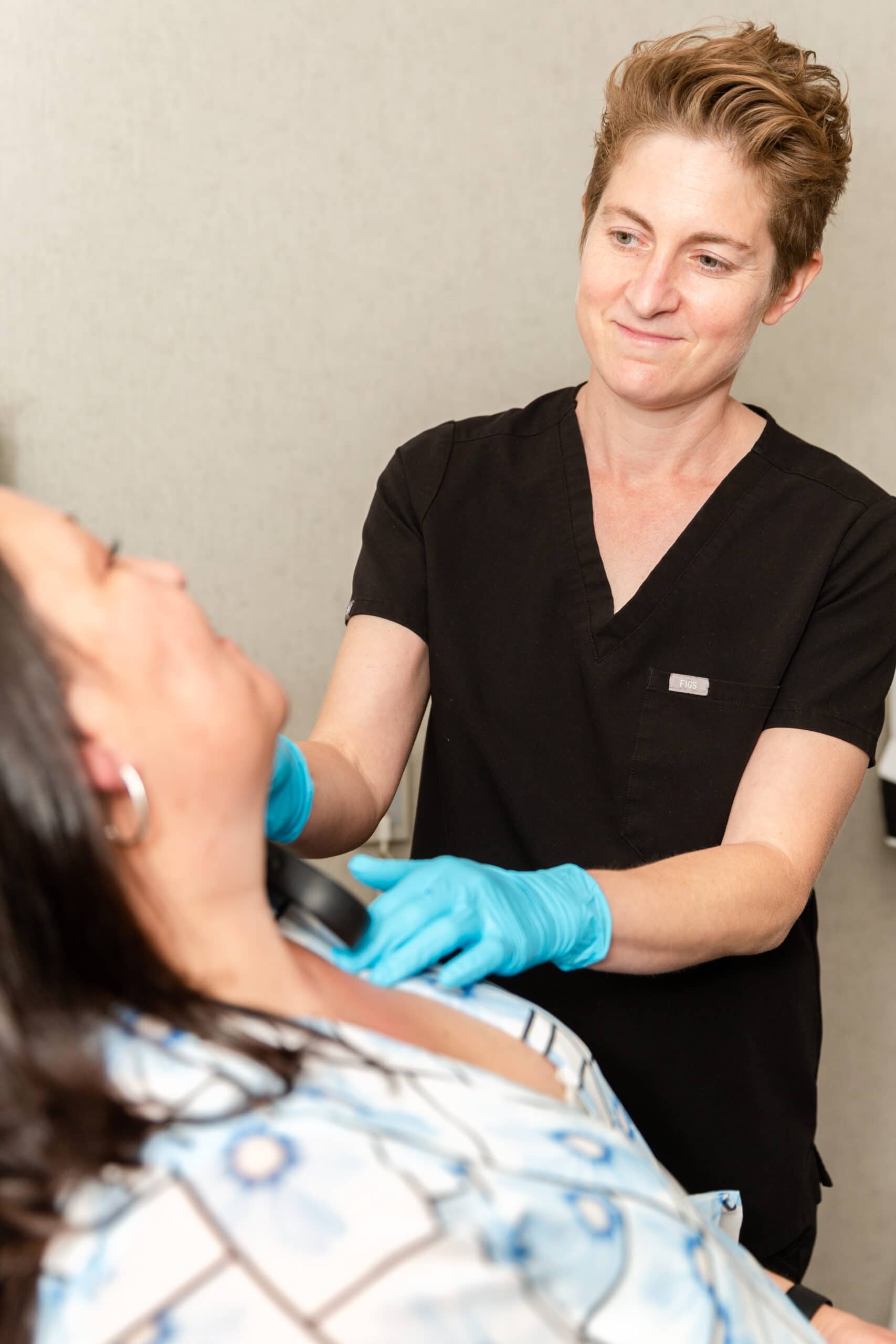 doctor with her rosacea patient