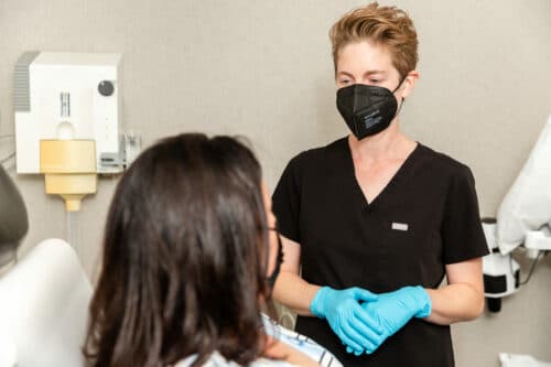 dermatologist explaining hives treatment to the patient