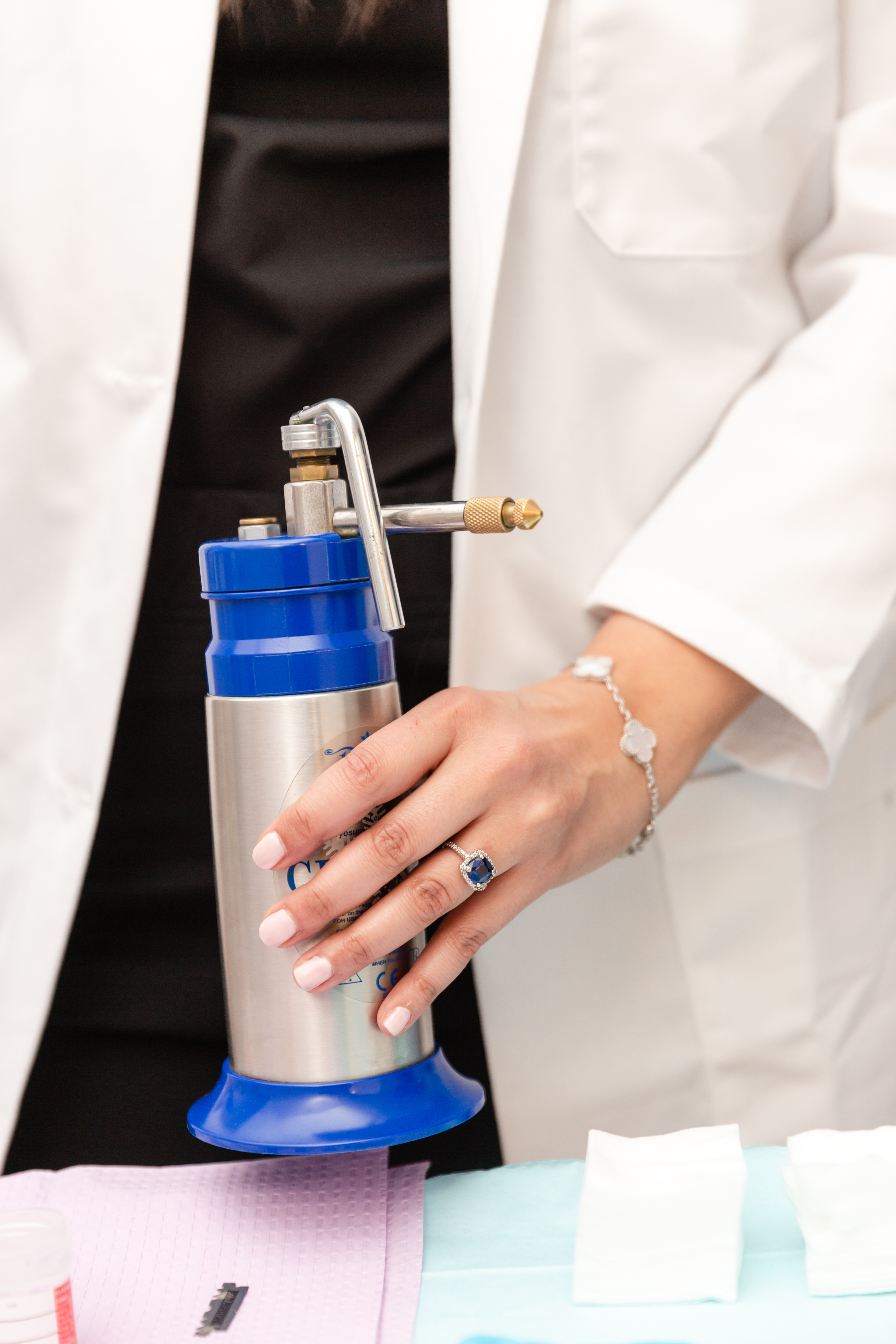 a new jersey doctor holding a device for cryotherapy for warts 