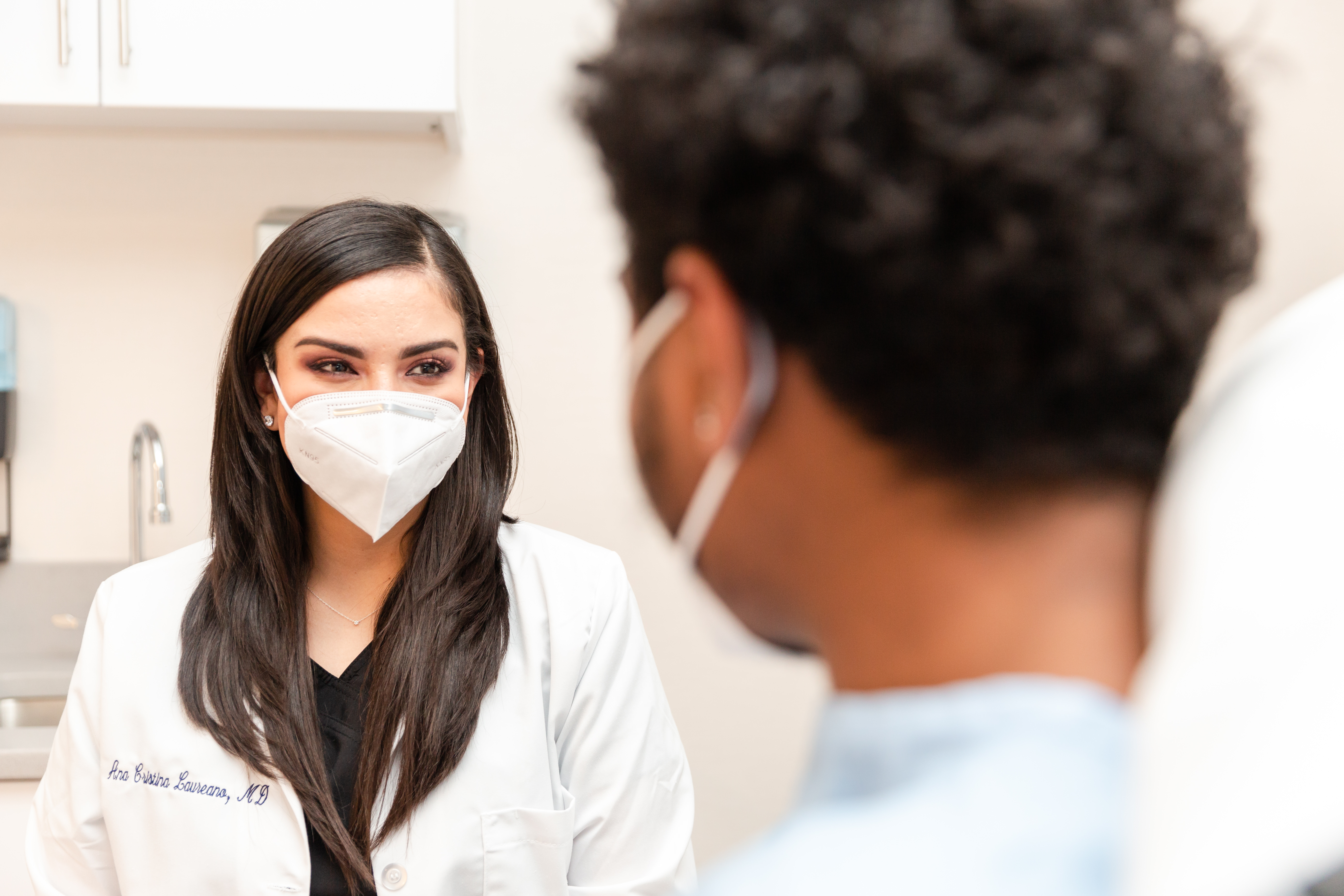 dermatologist with her patients discussing possible treatments for herpes zoster