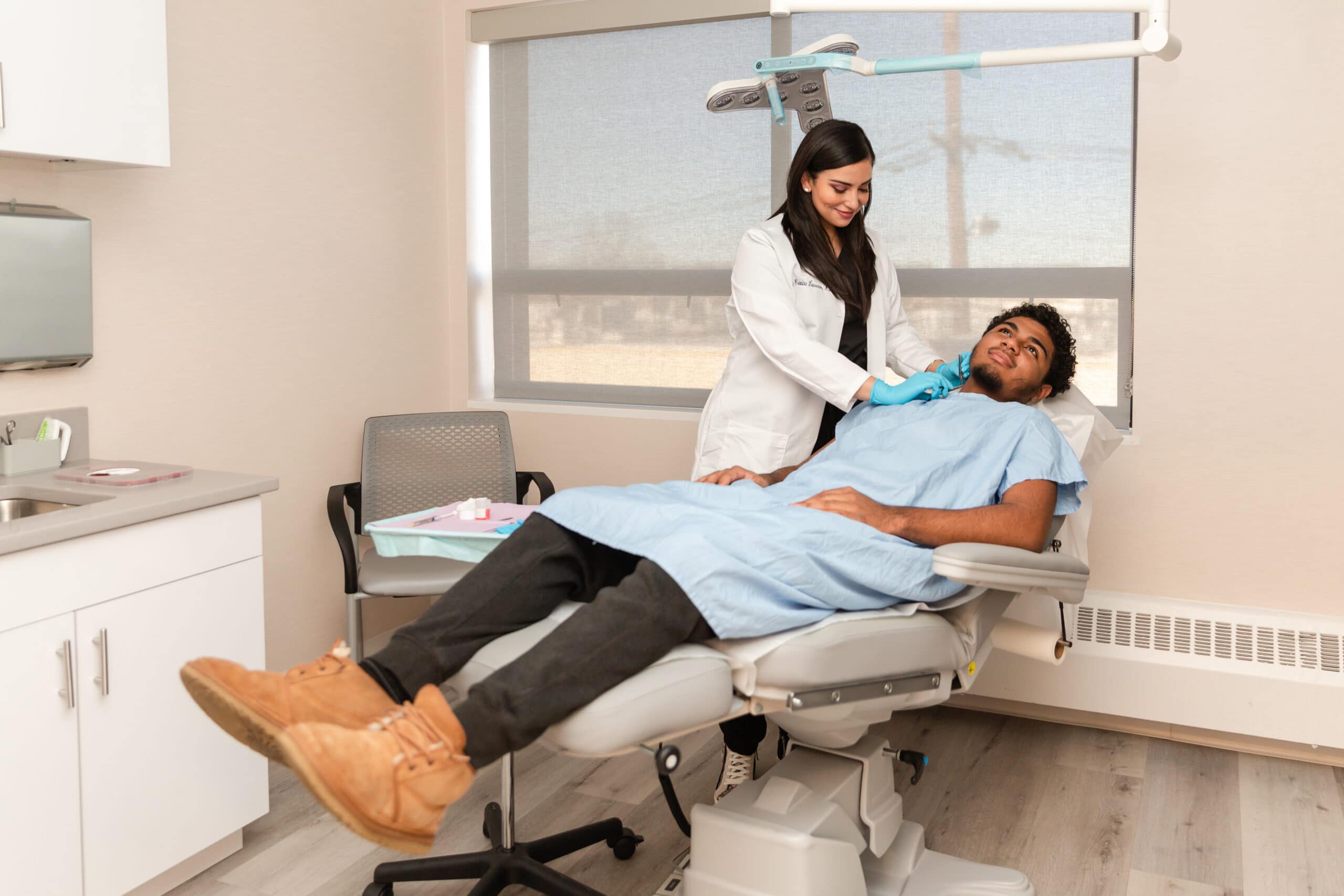 doctor examining patient's skin for seborrheic keratosis