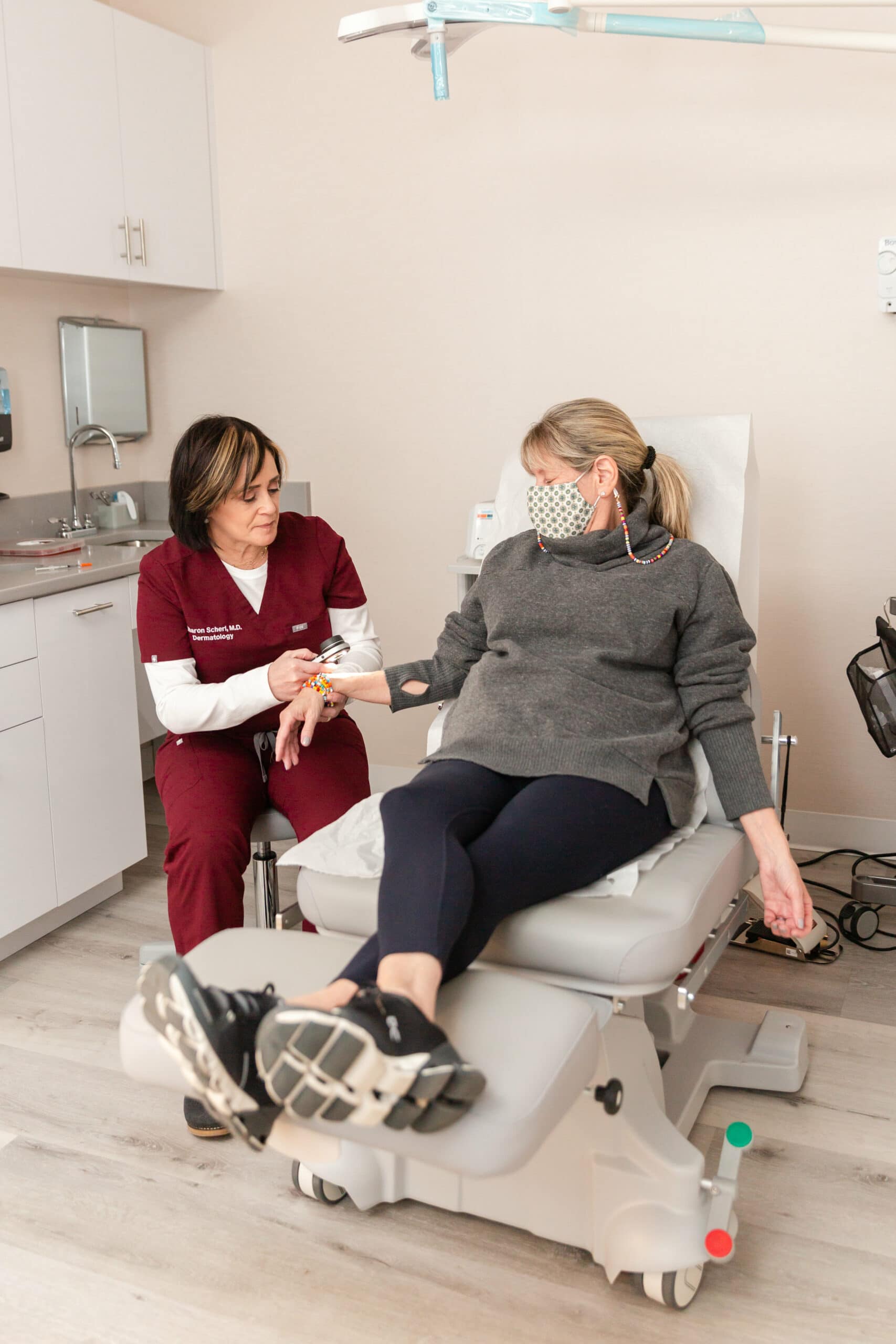 dermatologist and her patient discussing basal cell carcinoma treatments