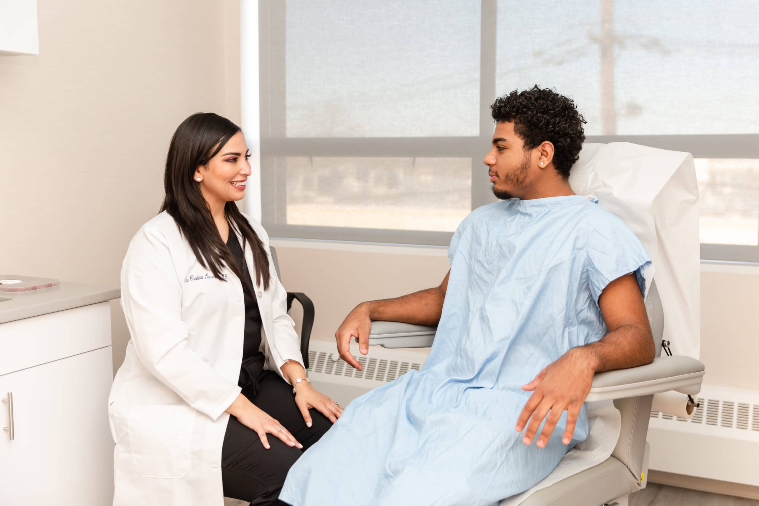 dermatologist consulting a patient regarding genital wart treatment